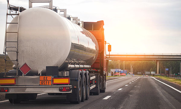 tank truck driving on the highway with sunset background transporting liquid materials five key features of transportation safety and efficiency