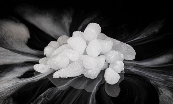 pile of sugar cubes and crystals on a black background emphasizing sweet flavors in baking and cooking techniques 11 sugar varieties