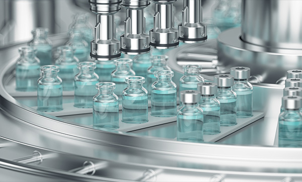vials of liquid in a production line with robotic machinery automated process for pharmaceuticals six vials in production