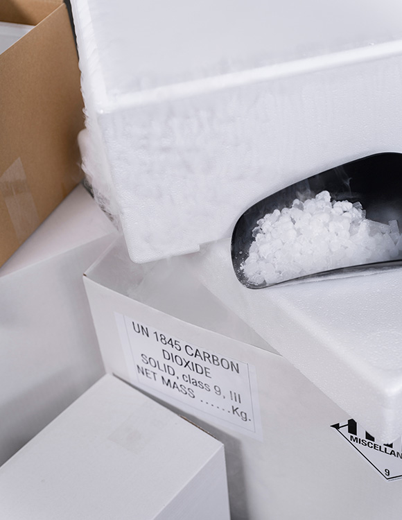 ice in container with label UN 1845 carbon dioxide solid class 9 packaging for safe transport of eight units of dry ice