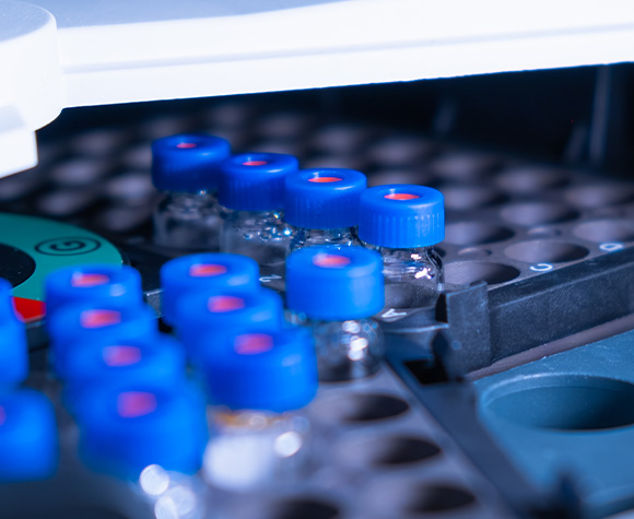 laboratory vials with blue caps arranged in a tray for analysis in a scientific setting showcasing the equipment used in chemical experiments 3 samples